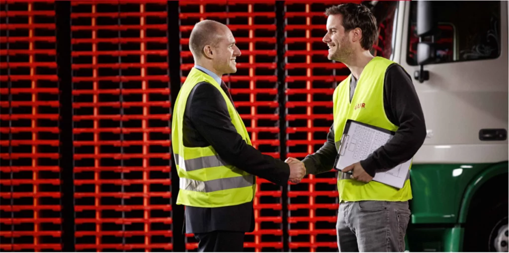 Low cost pallets stacked for distribution in logistics warehouse